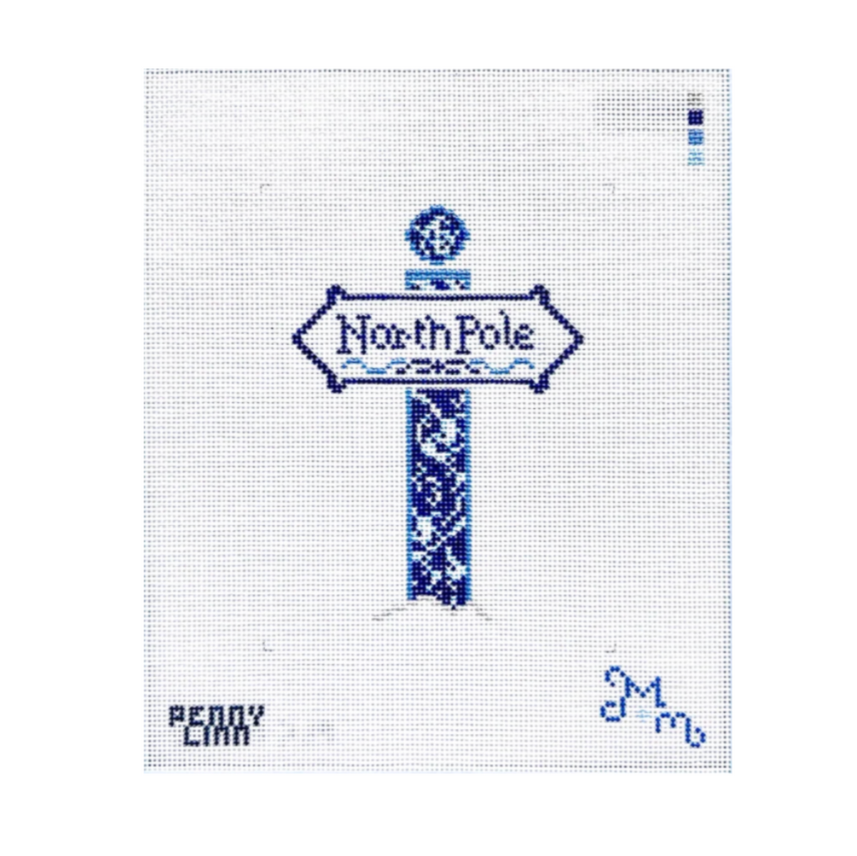 A needlepoint canvas featuring a blue and white stitched design of a 'North Pole' sign, with 'PENNY CARR' and a blue signature in the bottom corners on a white grid background.