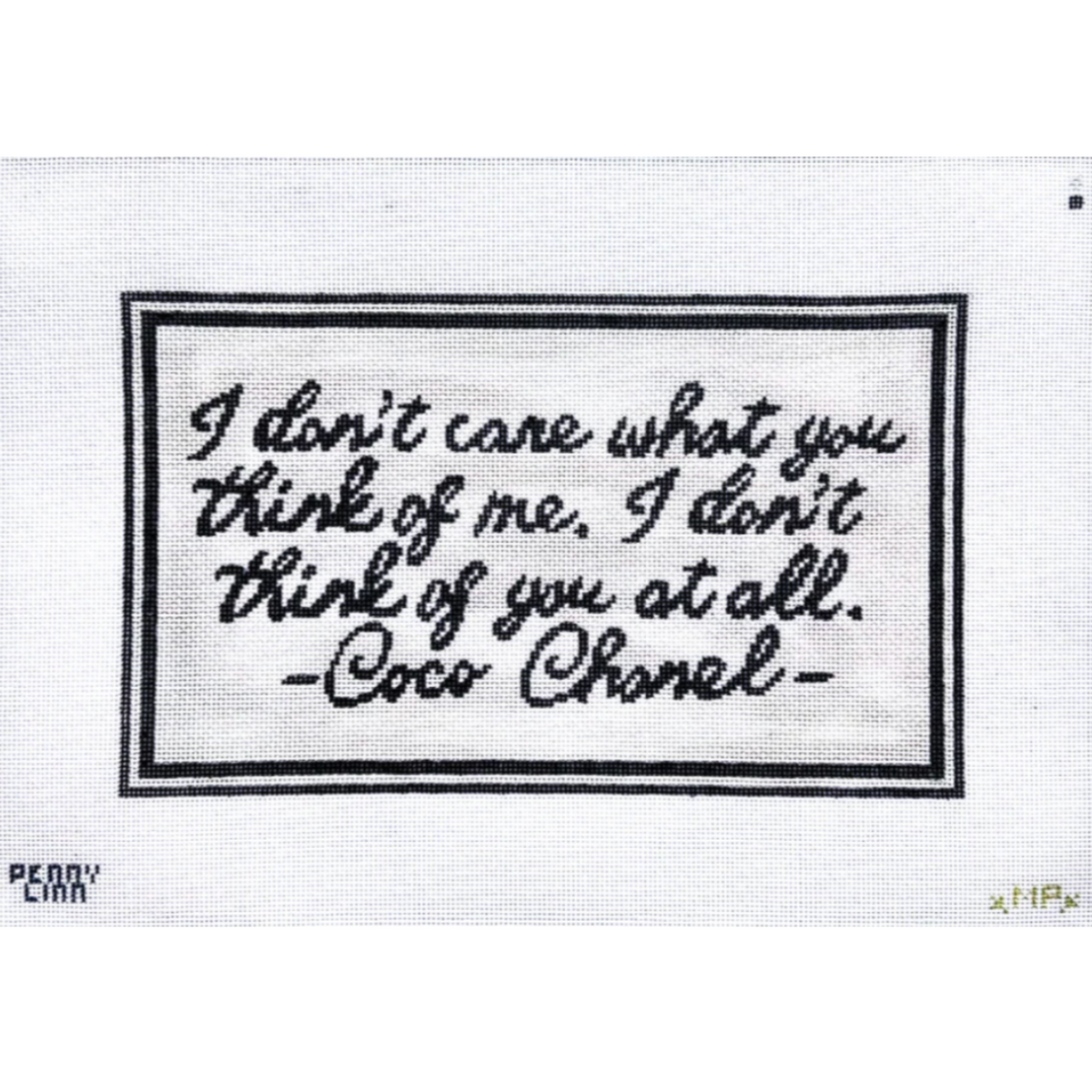 A square white fabric patch or label featuring a black embroidered border and the quote, 'I don't care what you think of me, I don't think of you at all. -Coco Chanel-' stitched in black script.