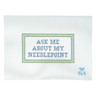 Cross-stitched fabric with 'Ask Me About My Needlepoint' text on a white background
