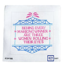 A square white needlepoint canvas featuring a cross-stitch style design with blue and pink text reading 'BEHIND EVERY MAHJONG WINNER ARE THREE WOMEN ROLLING THEIR EYES' on a white background.