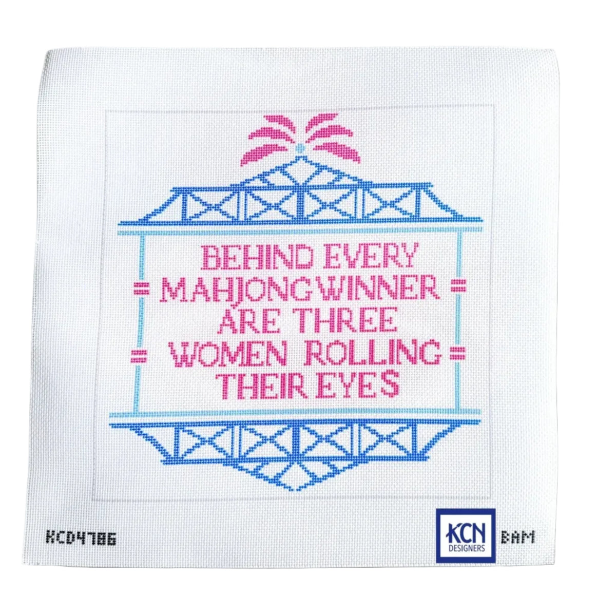 A square white needlepoint canvas featuring a cross-stitch style design with blue and pink text reading 'BEHIND EVERY MAHJONG WINNER ARE THREE WOMEN ROLLING THEIR EYES' on a white background.