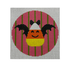 A square needlepoint canvas featuring a stylized candy corn with black bat wings, set against a pink circle with green vertical stripes on a white mesh grid background.