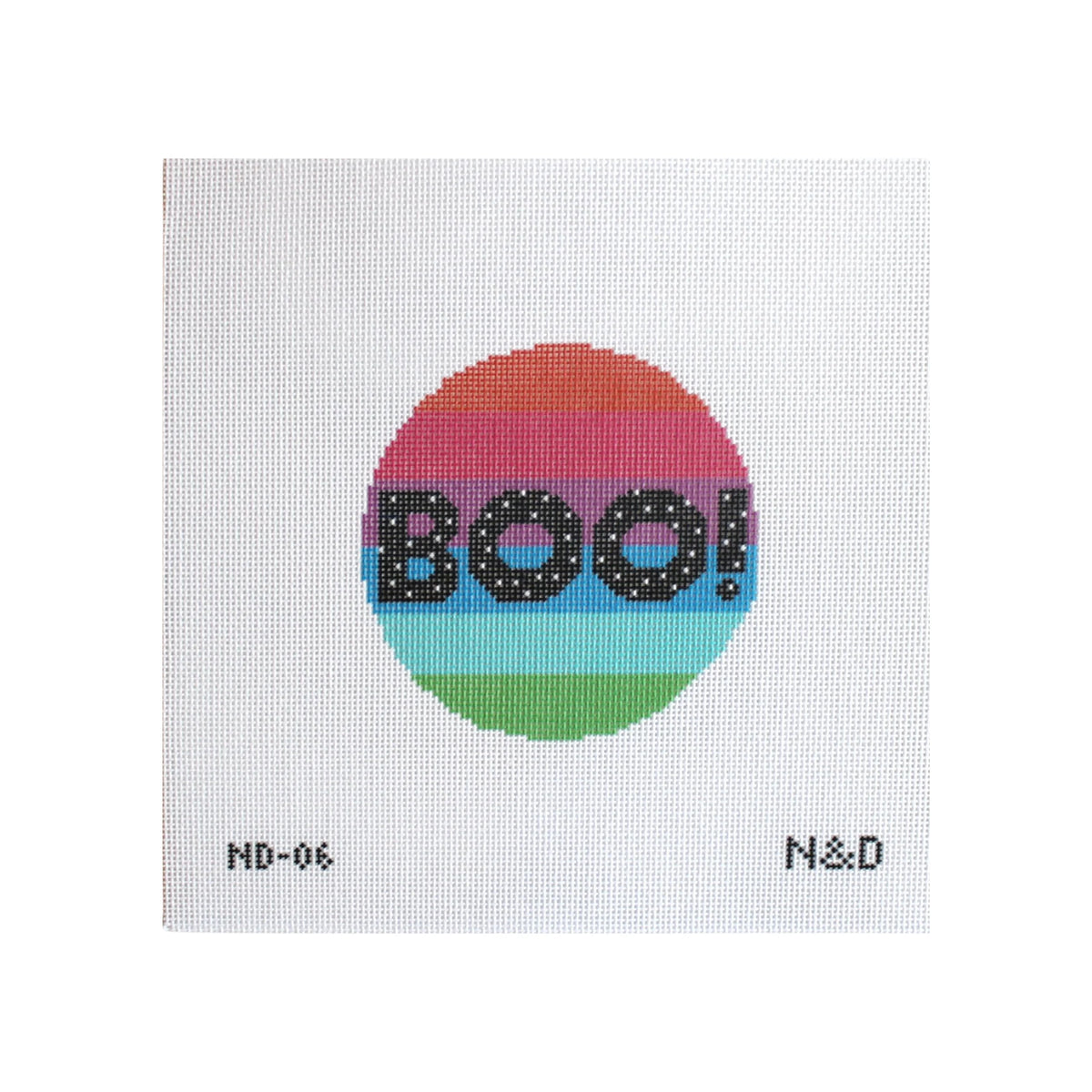 A square white needlepoint canvas featuring a circular design with horizontal rainbow stripes and the word 'BOO!' in black dotted letters. Small printed text appears at the bottom corners reading 'MD-06' and 'N&D'.