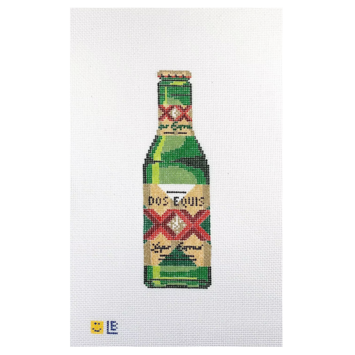 A needlepoint canvas featuring a pixelated depiction of a Dos Equis beer bottle on a white mesh background, with a small yellow smiley face and blue 'E' logo in the bottom-left corner.