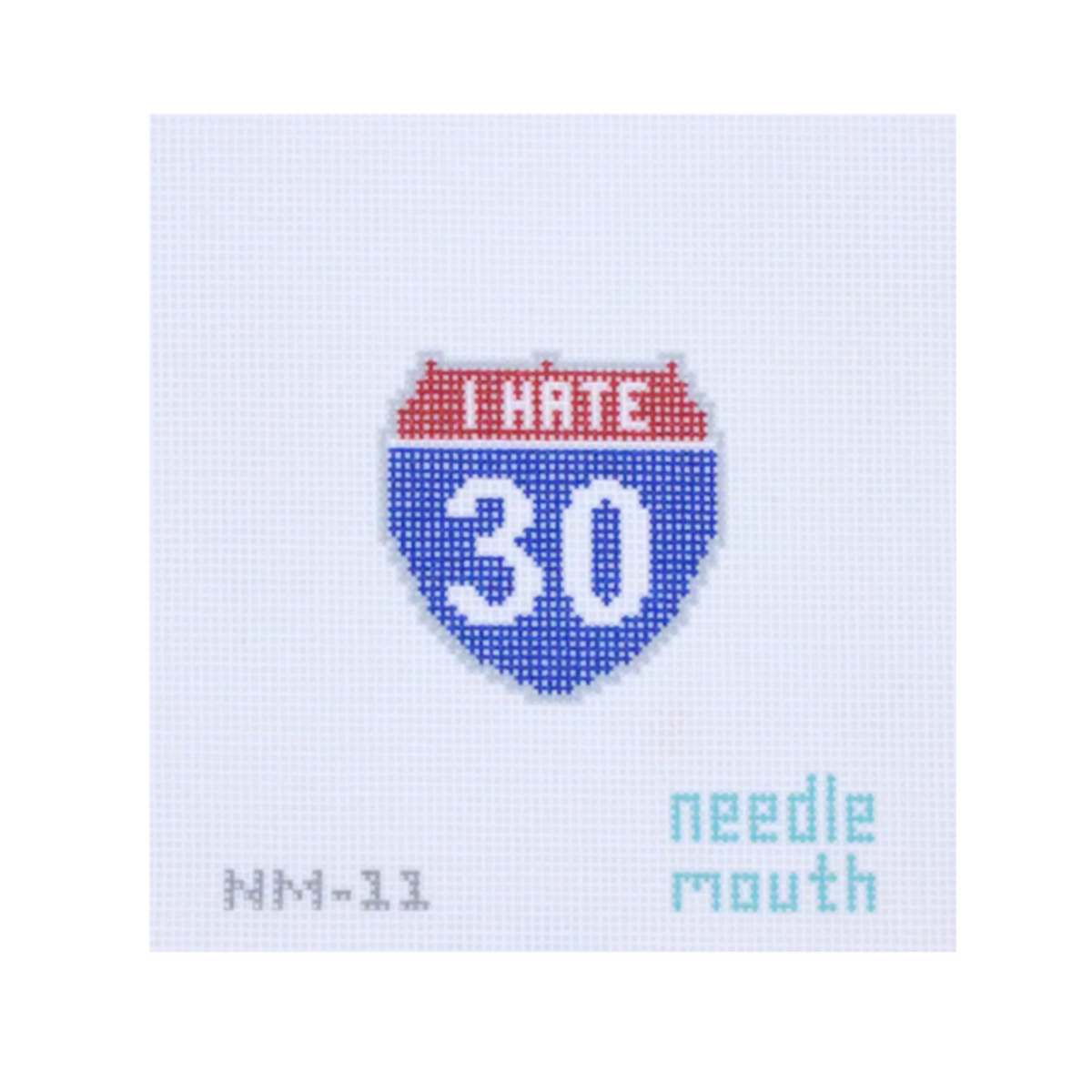 A needlepoint canvas featuring a stylized Interstate 30 shield in red, white, and blue, with 'NM-11' and 'needle mouth' text on a pale blue grid background.