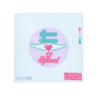 A cross-stitch style design on a white grid background, featuring a pastel circular motif with the words 'Jesus loves me' in teal and pink, a pink heart, white wings, and 'I spend' below. A small color swatch strip appears on the right, and the code 'LLM-056' appears at bottom left.
