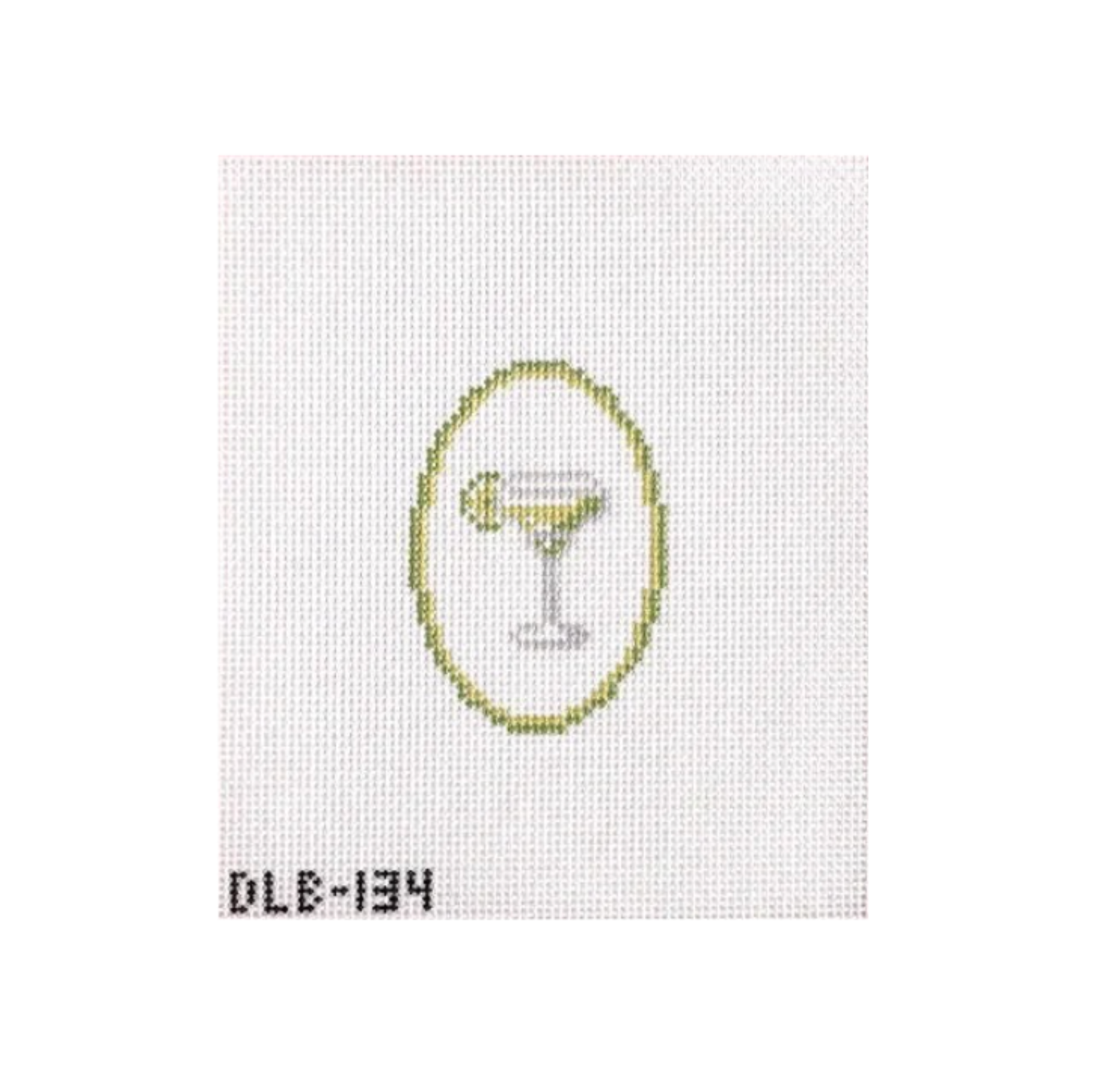 A small embroidered or printed cocktail glass motif centered on a white textured square, with a yellow oval outline behind it and the code 'DLE-134' at the bottom left.