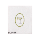 A small embroidered or printed cocktail glass motif centered on a white textured square, with a yellow oval outline behind it and the code 'DLE-134' at the bottom left.