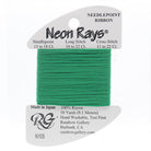 Green needlepoint ribbon on a white card with branding information