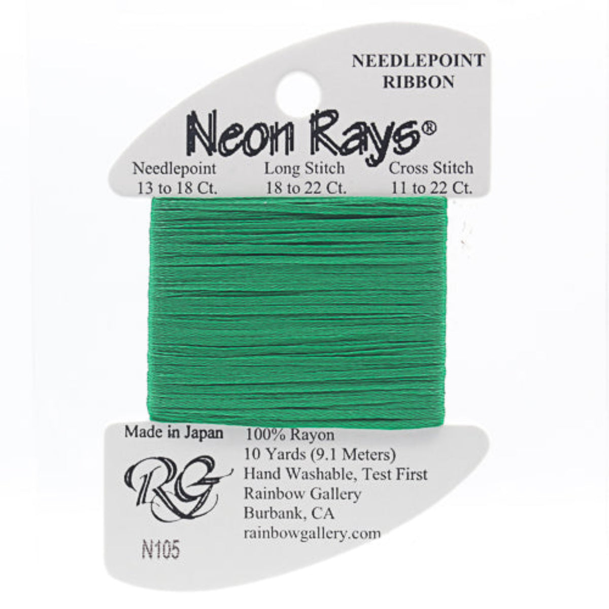 Green needlepoint ribbon on a white card with branding information
