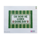 A cross-stitch needlework canvas featuring the text 'OH HOW HE LOVES GAME DAY' in green and white, framed by green and white stripes with small football motifs. The canvas is displayed flat against a white background with an August Needleworks label visible in the bottom right corner.