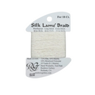 A spool of Rainbow Gallery Silk Lame' Braid needlepoint thread in a light cream/off-white color, packaged on a white cardboard hanger with product details printed on it.