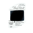 A spool of black thread wrapped around a white cardboard hanger, labeled 'Very Velvet' with needlepoint and cross stitch text, photographed on a plain white background.